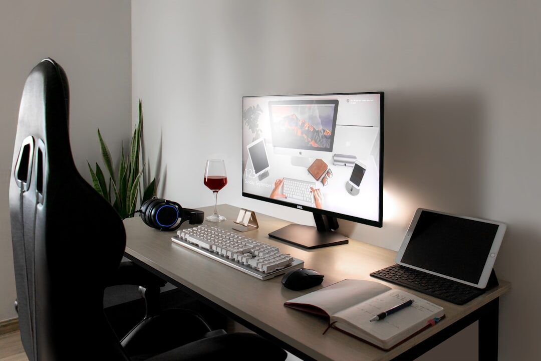 Editorial desk with notes, laptop and printed drafts